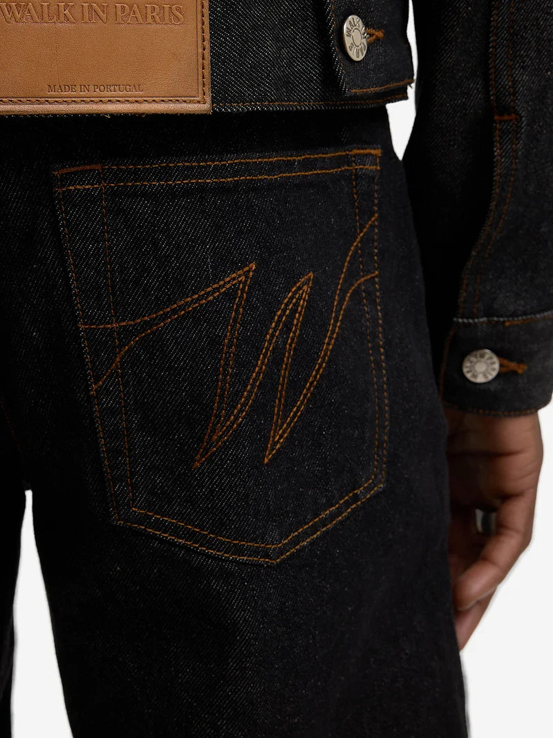 Le pantalon regular en denim brut